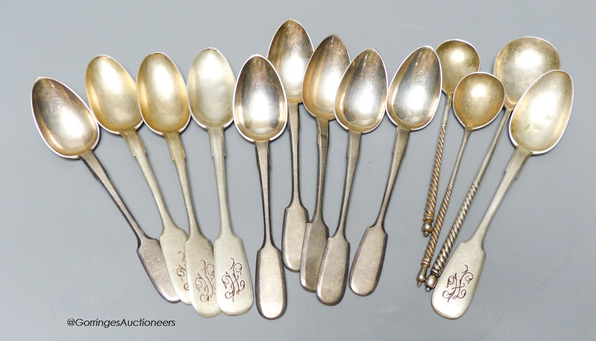 A small collection of Russian 84 zolotnik spoons including a set of six early 20th century by Morozov and three with spiral twist handles and engraved bowls